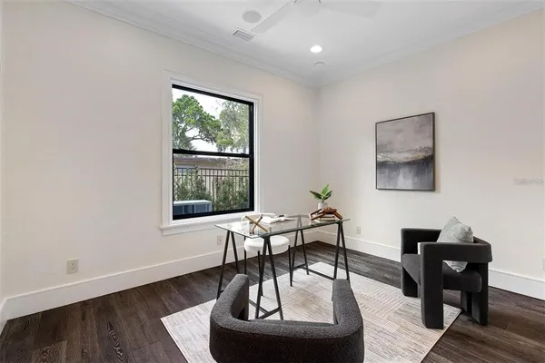 a work room with furniture and a window