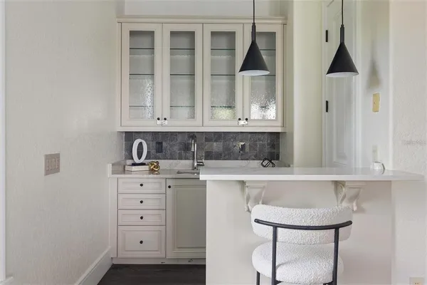 a kitchen with stainless steel appliances a cabinets and a stove top oven