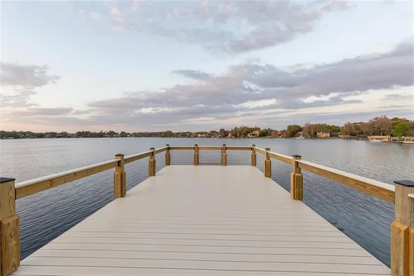 a view of a lake and outdoor seating