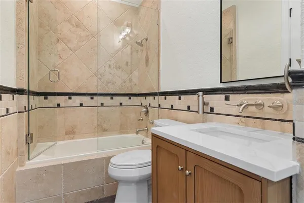 a bathroom with a bathtub and a sink