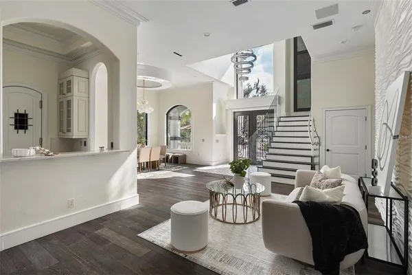 a living room with furniture a fireplace and decor