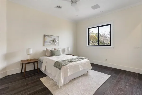 a bedroom with a bed and a desk
