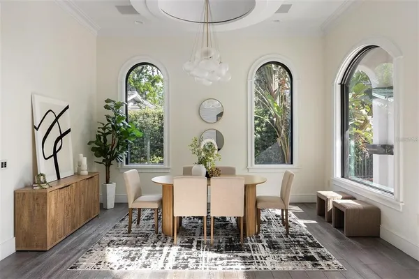 a view of a dining room with furniture and a window