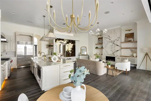 a large kitchen with a table and chairs