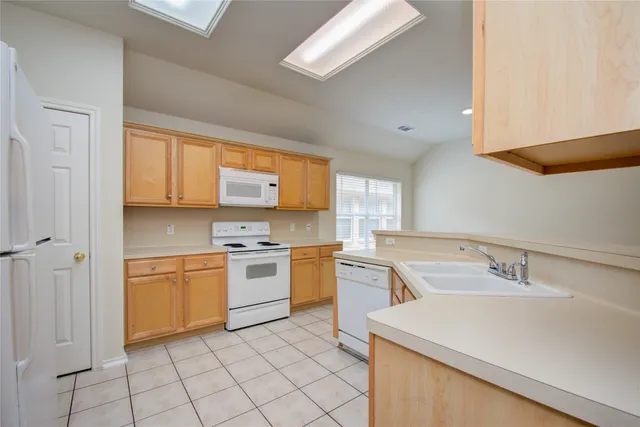 a kitchen with a stove oven and sink