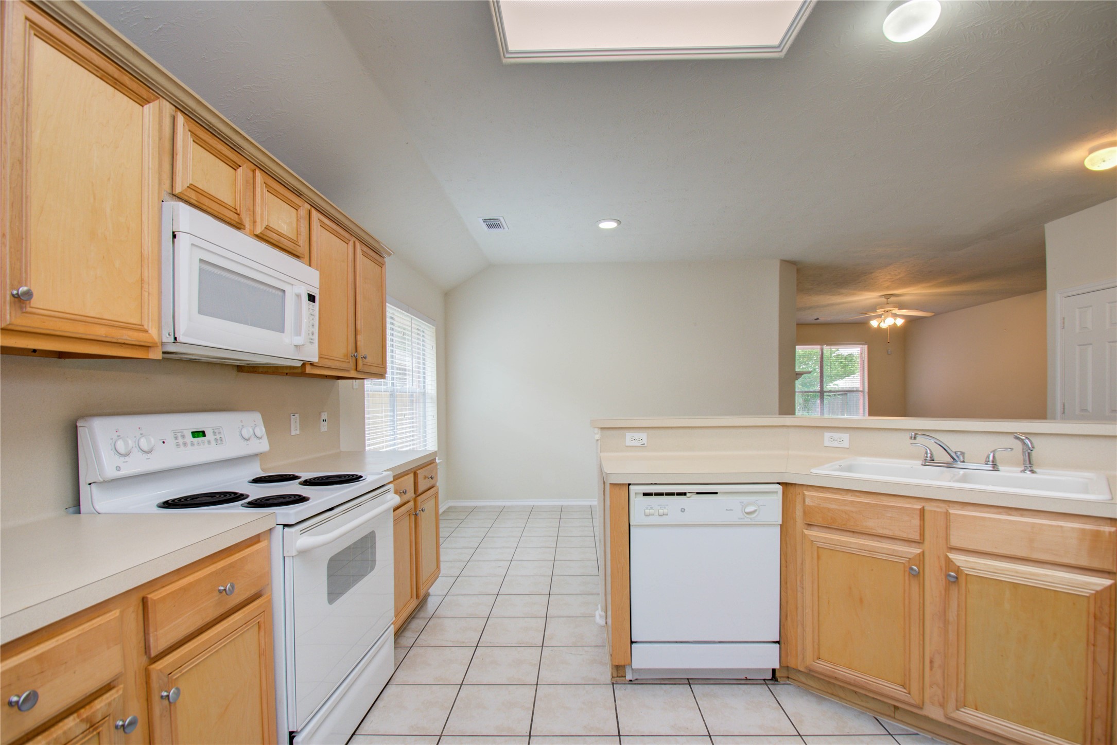 5715 Afton Ridge Lane Houston, TX 77084 - Photo 16 of 37 a kitchen with a stove oven and sink