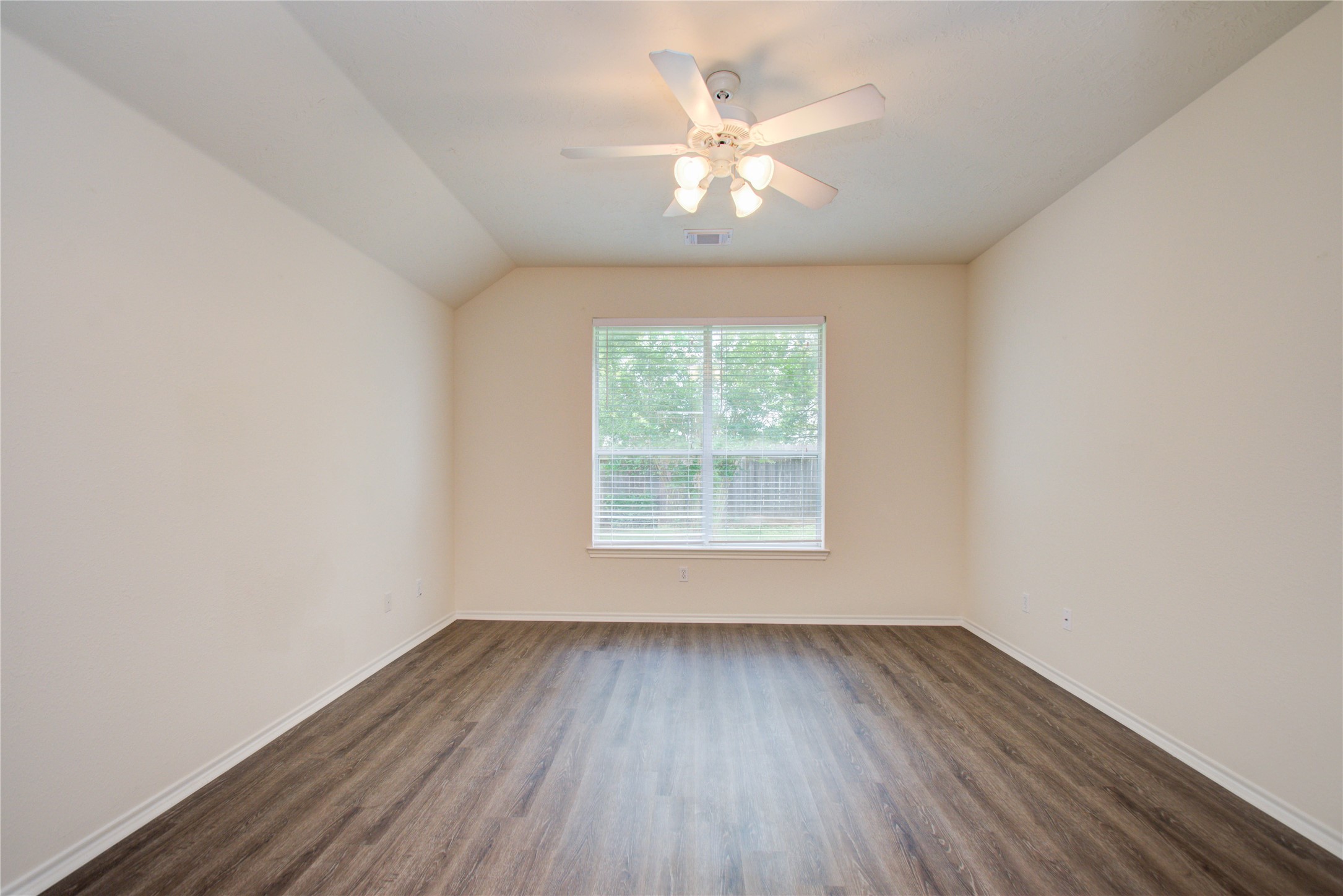 5715 Afton Ridge Lane Houston, TX 77084 - Photo 24 of 37 an empty room with wooden floor and windows