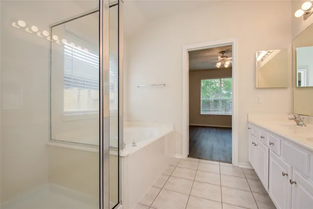 a view of walk in closet with wooden floor