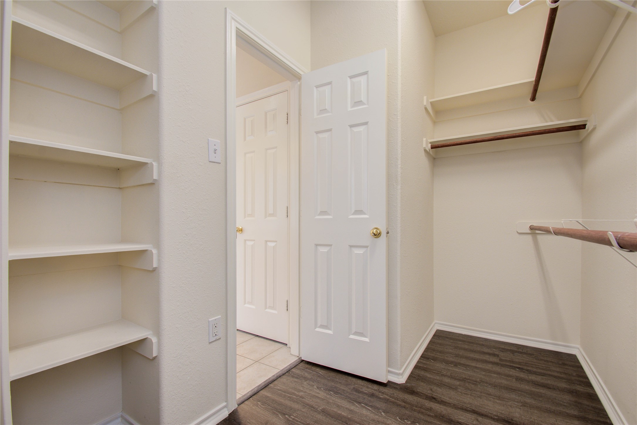 5715 Afton Ridge Lane Houston, TX 77084 - Photo 27 of 37 a view of walk in closet with wooden floor