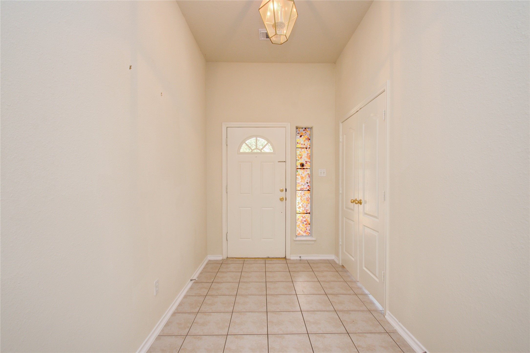 5715 Afton Ridge Lane Houston, TX 77084 - Photo 7 of 37 a view of an empty room with wooden floor and a window