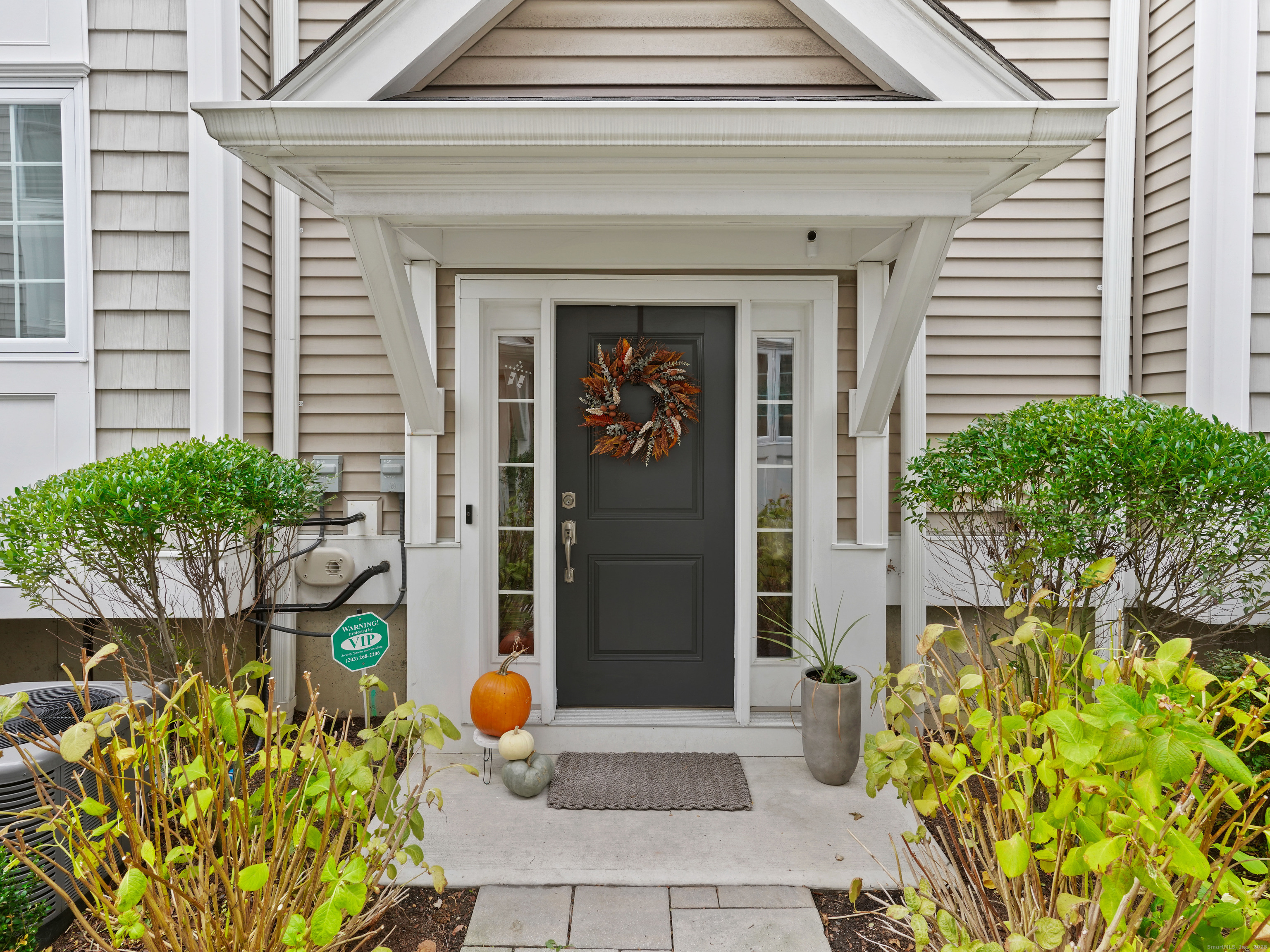 a front view of a house with outdoor seating