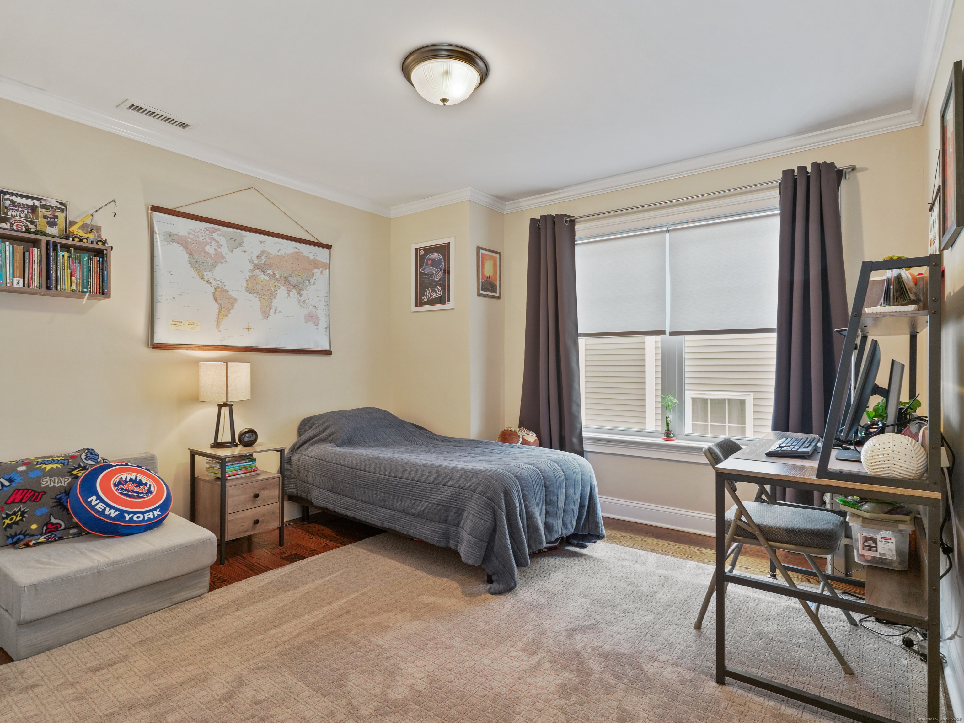 91 West Broad Street, Unit 11 Stamford, CT 06902 - Photo 14 of 26 a bedroom with furniture and a large window