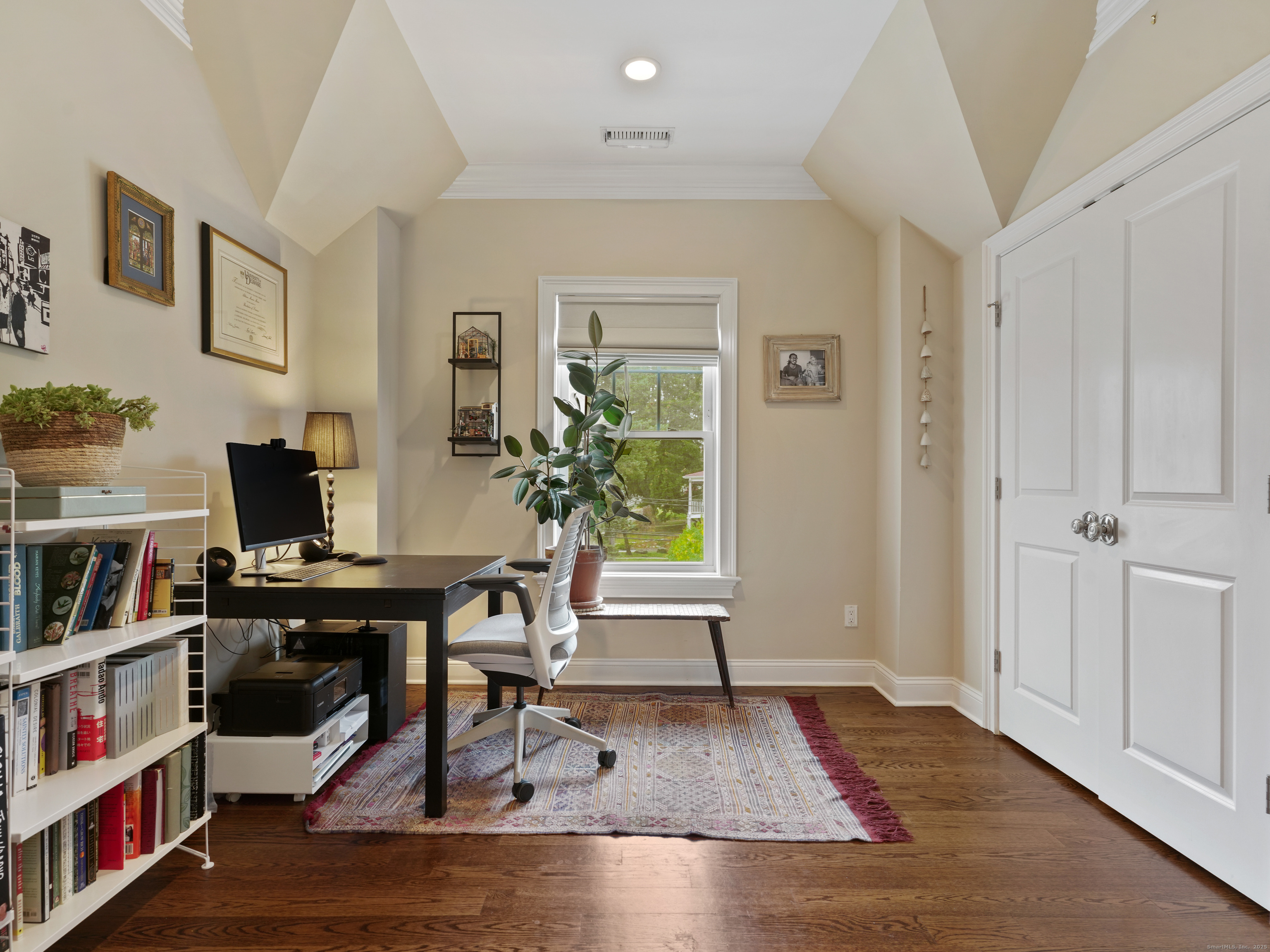 91 West Broad Street, Unit 11 Stamford, CT 06902 - Photo 20 of 26 a view of a workspace room with furniture and wooden floor