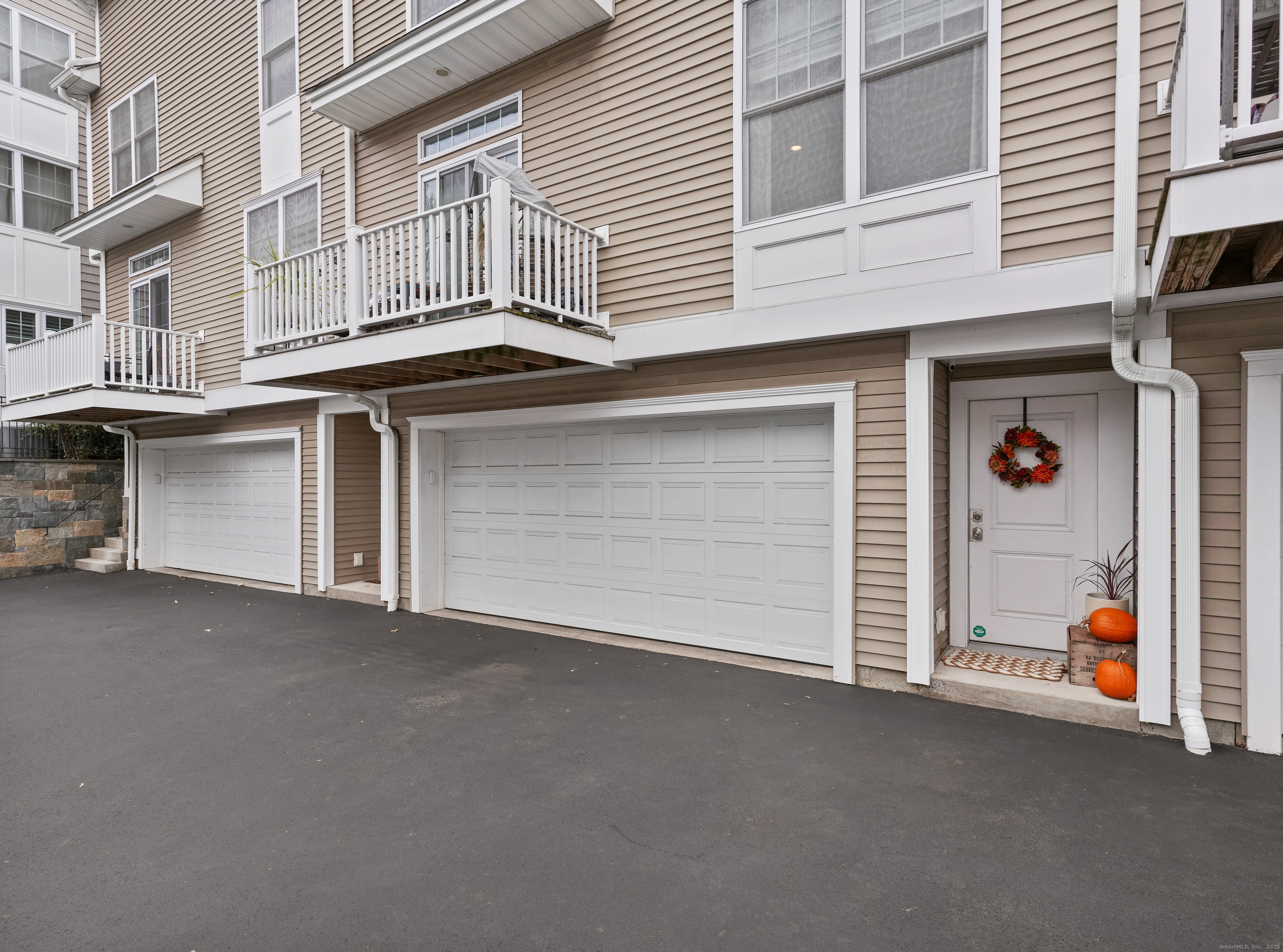 91 West Broad Street, Unit 11 Stamford, CT 06902 - Photo 25 of 26 a view of a house with a garage
