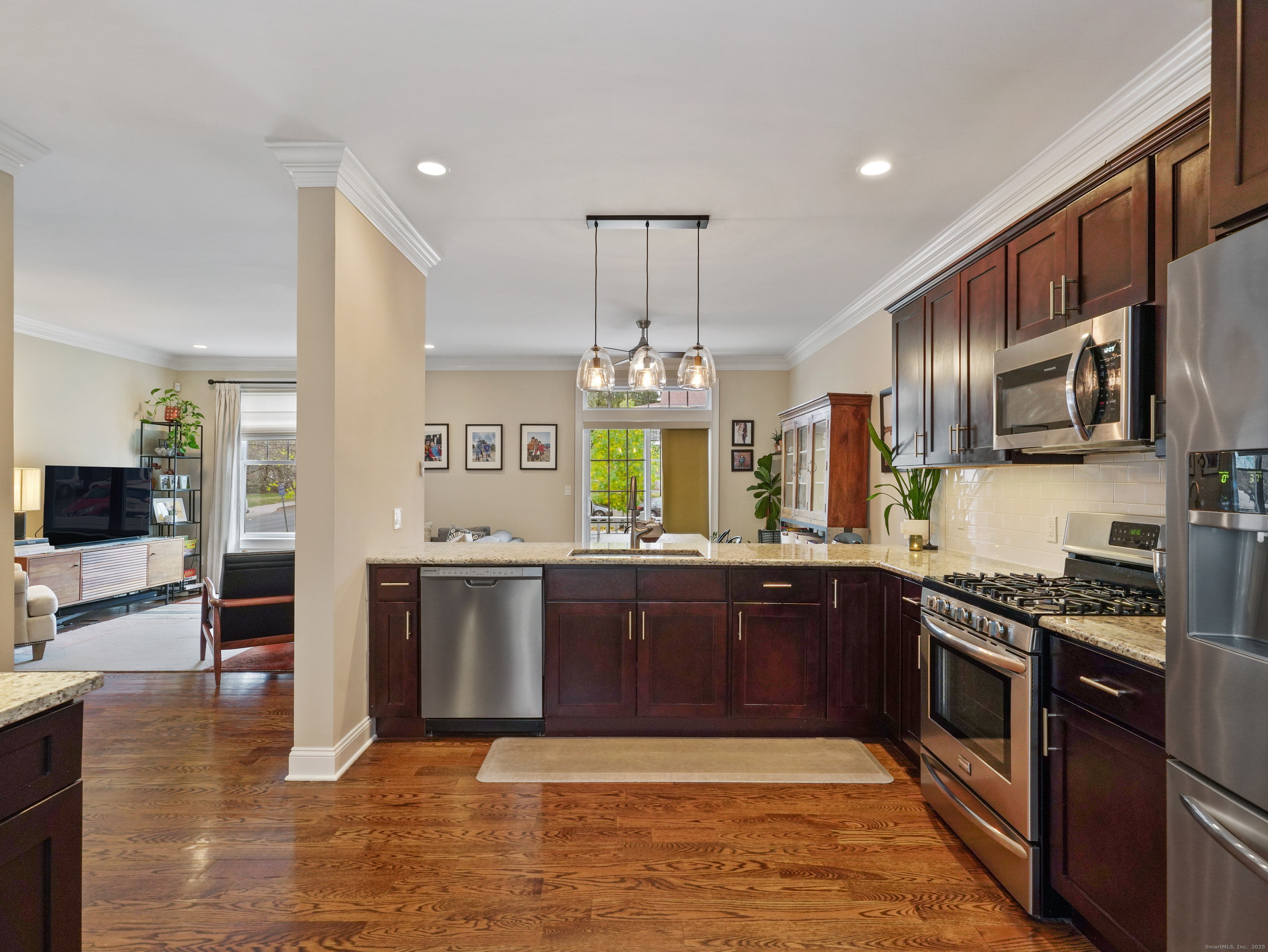 91 West Broad Street, Unit 11 Stamford, CT 06902 - Photo 3 of 26 a large kitchen with stainless steel appliances granite countertop a stove and a sink