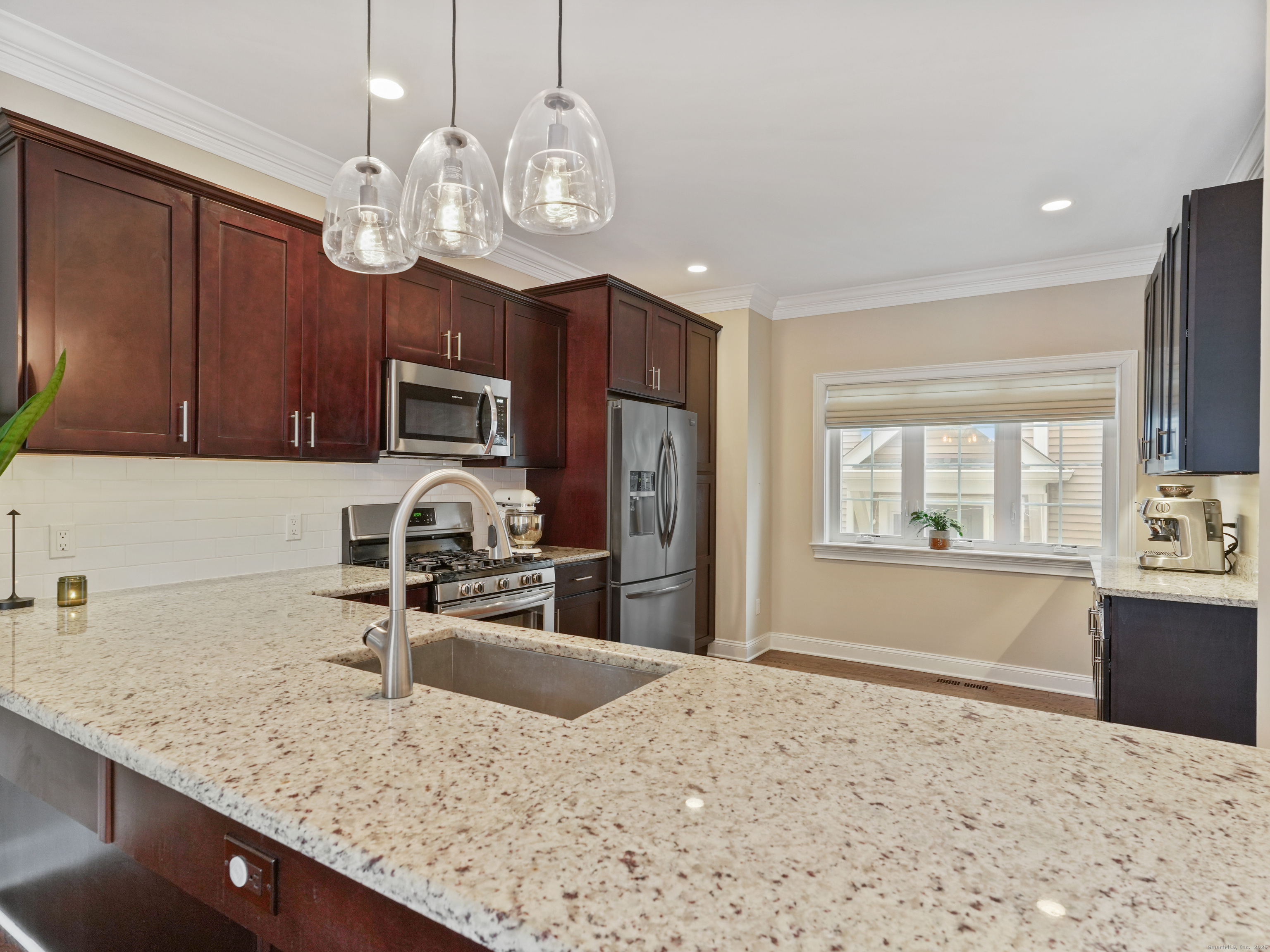 91 West Broad Street, Unit 11 Stamford, CT 06902 - Photo 5 of 26 a kitchen with sink cabinets and window
