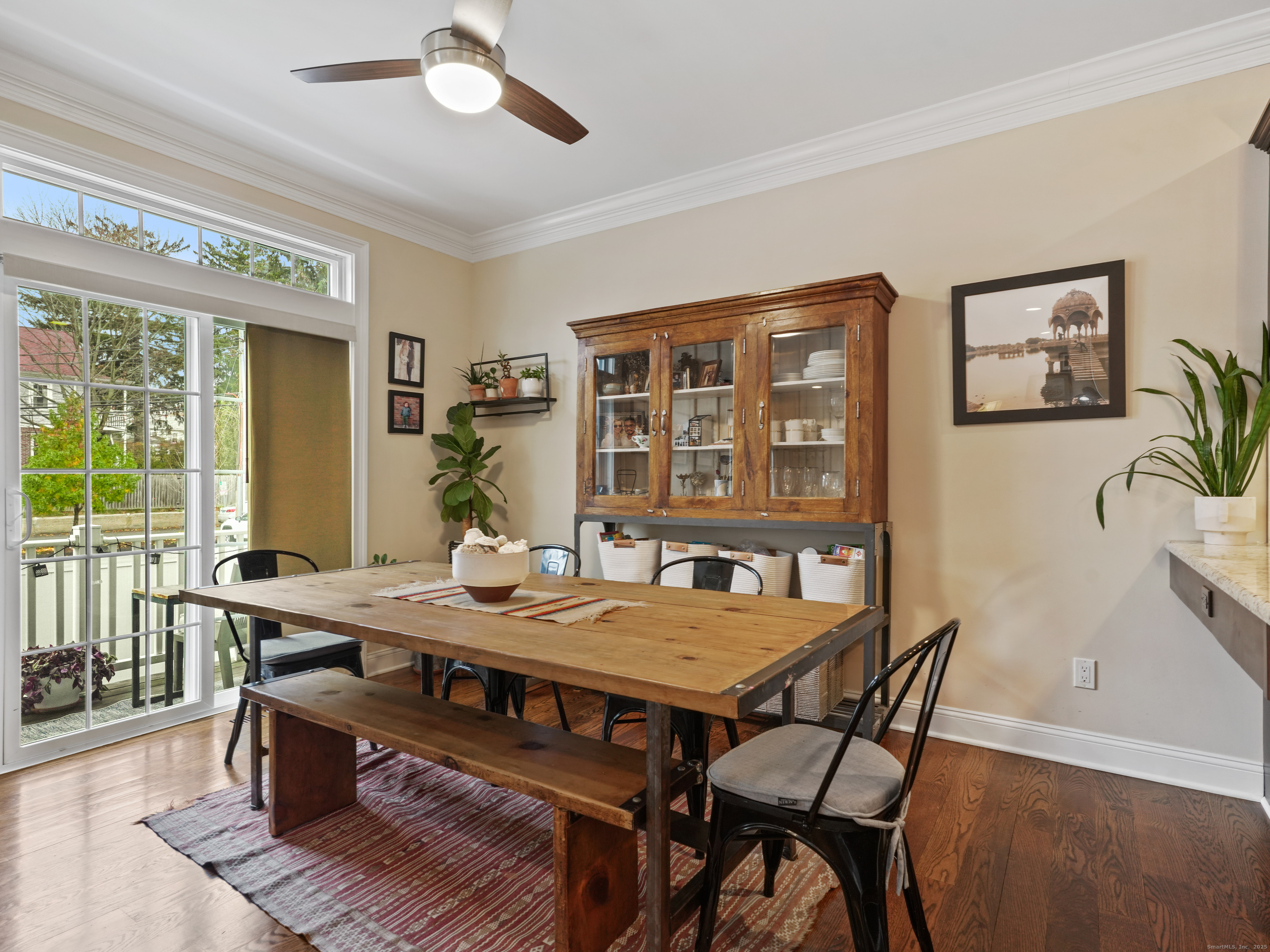 91 West Broad Street, Unit 11 Stamford, CT 06902 - Photo 7 of 26 a view of a dining room with furniture window and wooden floor