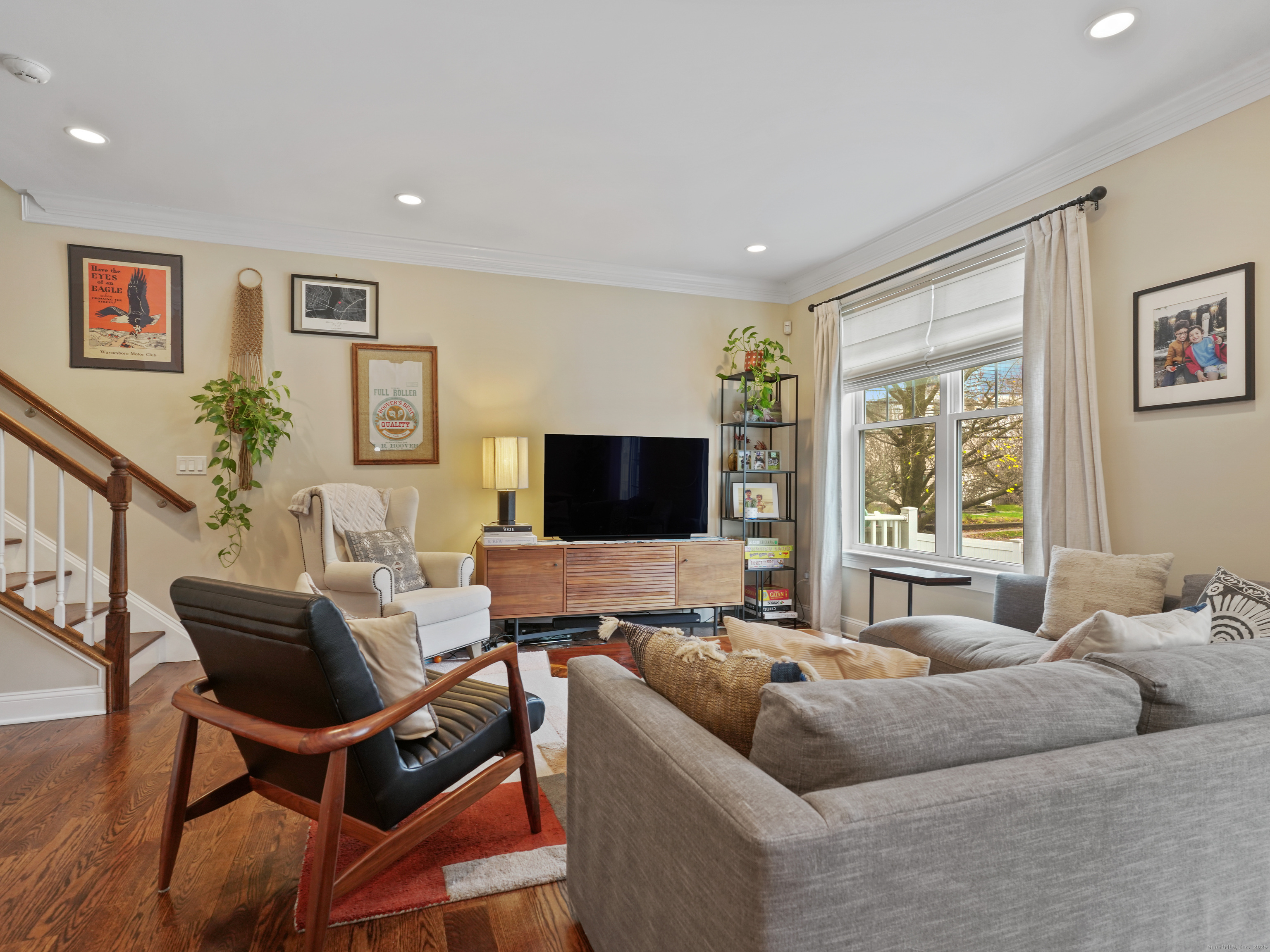 91 West Broad Street, Unit 11 Stamford, CT 06902 - Photo 9 of 26 a living room with furniture and a flat screen tv