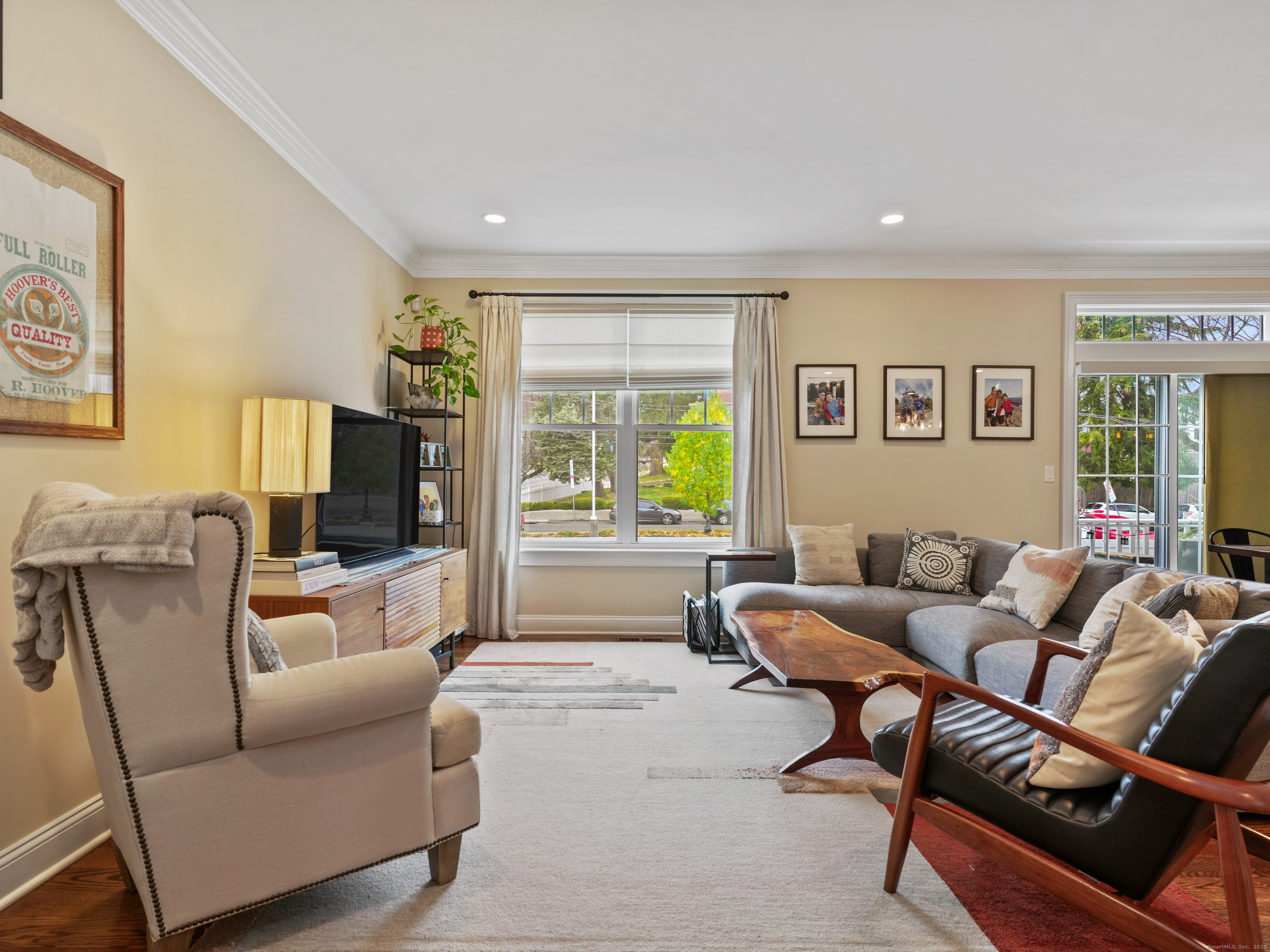 91 West Broad Street, Unit 11 Stamford, CT 06902 - Photo 10 of 26 a living room with furniture and a flat screen tv