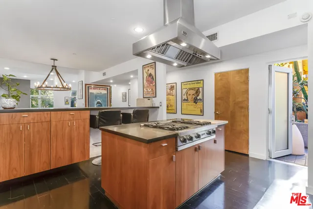 a kitchen that has a lot of cabinets in it