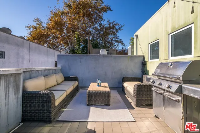 a backyard of a house with seating space