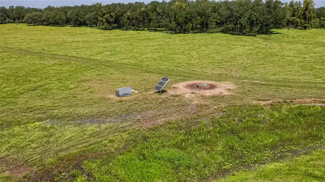 a view of a lake with a building in the background