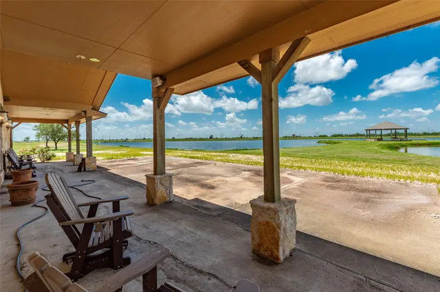 a view of a lake with houses in the back
