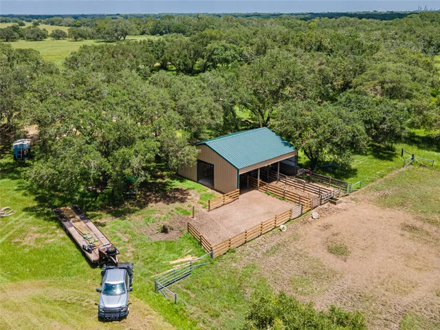 a backyard of a house with a yard and outdoor seating