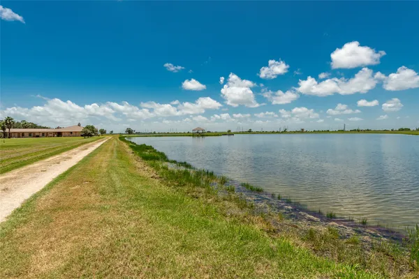 a view of a golf course with a lake