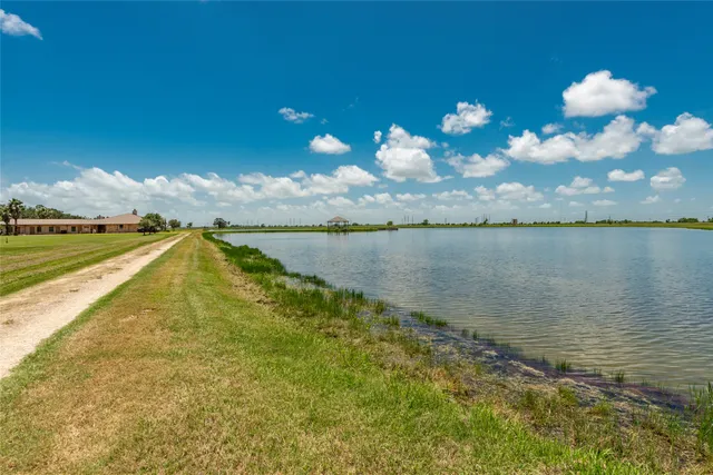 a view of a golf course with a lake