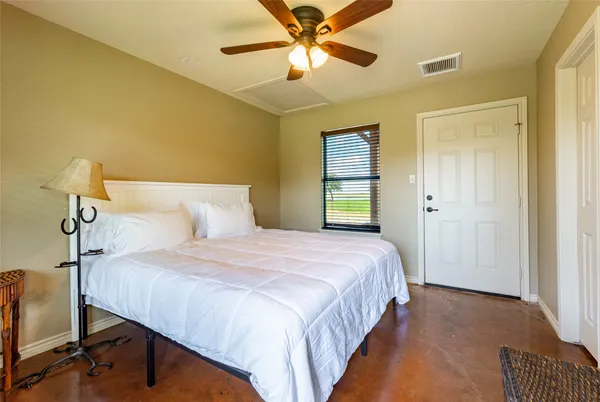 a bed room with a bed and a television