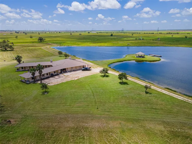 a view of an swimming pool with a yard