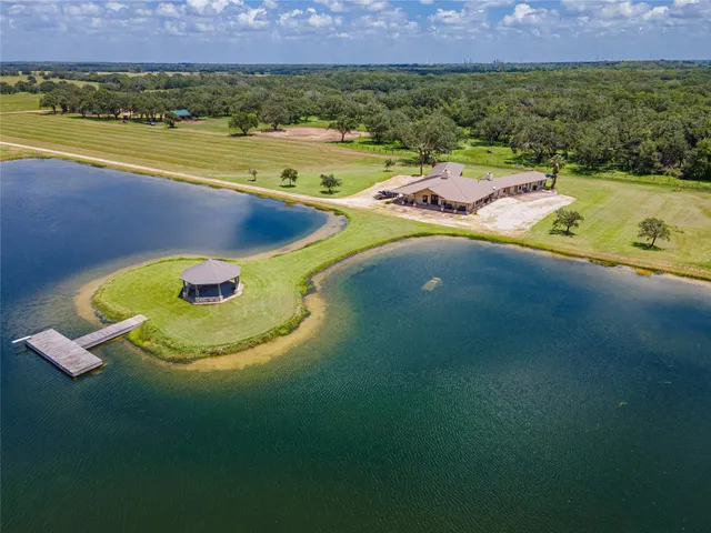 a view of a swimming pool with a yard