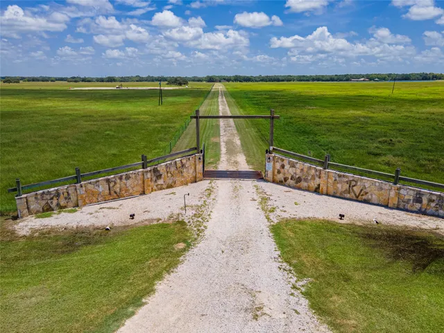 a view of a swimming pool with a yard