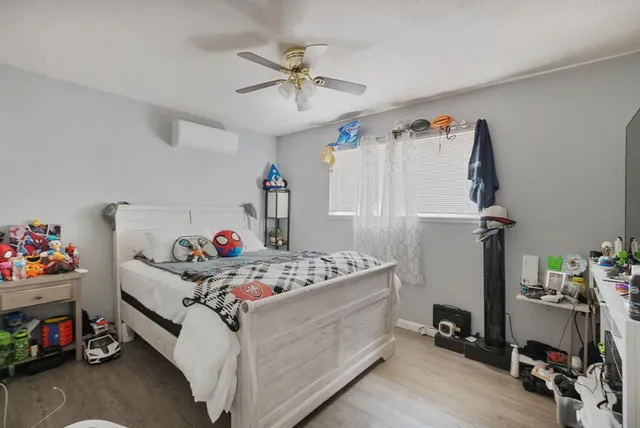 a bed room with furniture and a window