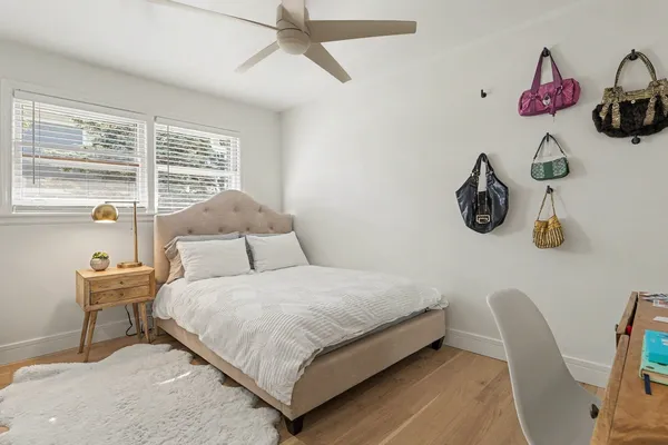 a bedroom with a bed and window