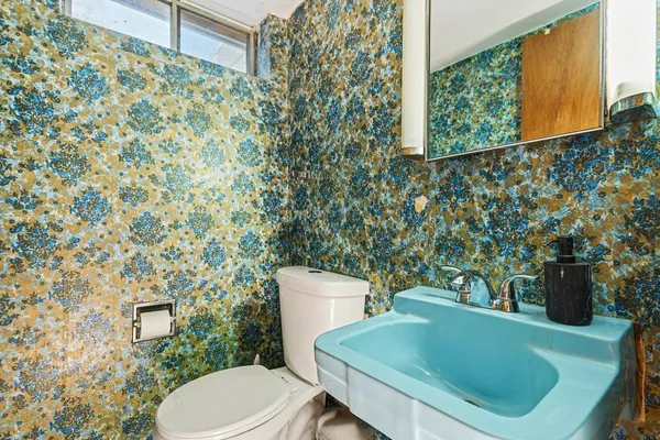 a bathroom with a toilet and a sink