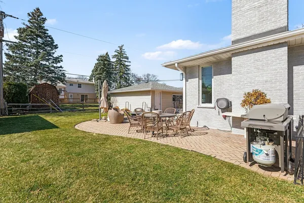 a view of a house with backyard water and sitting area