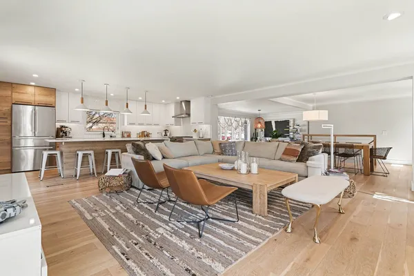 a living room with lots of furniture and a table