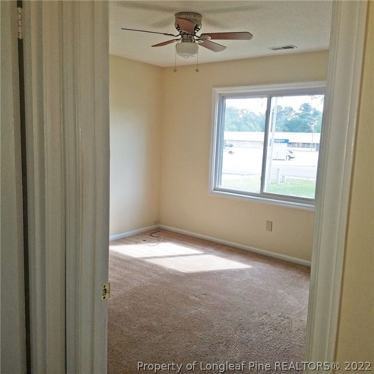 6596 Fisher Road Fayetteville, NC 28304 - Photo 12 of 27 a view of an empty room with a window