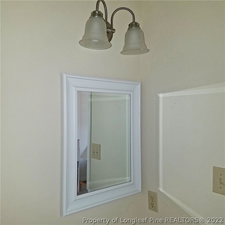 6596 Fisher Road Fayetteville, NC 28304 - Photo 23 of 27 a bathroom with a shower