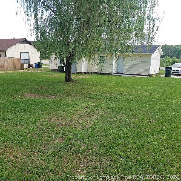 6596 Fisher Road Fayetteville, NC 28304 - Photo 27 of 27 a front view of a house with garden