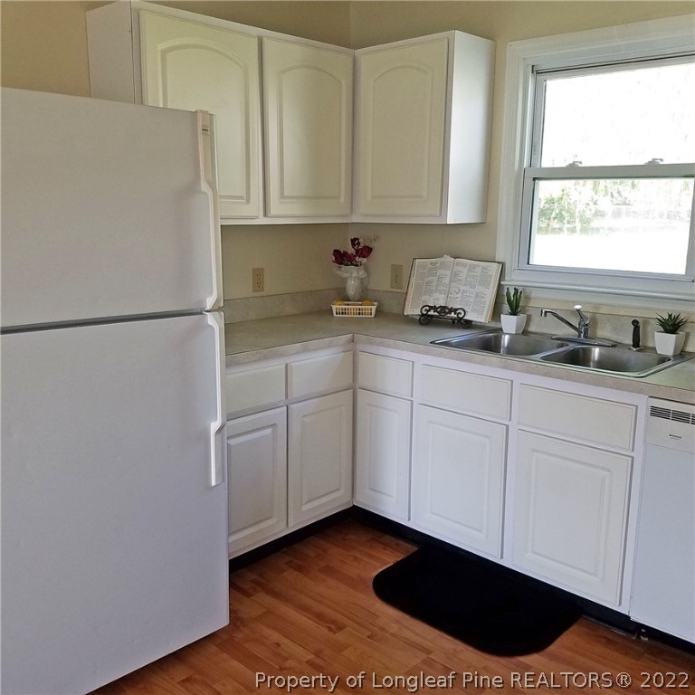 6596 Fisher Road Fayetteville, NC 28304 - Photo 6 of 27 a white refrigerator freezer sitting inside of a kitchen