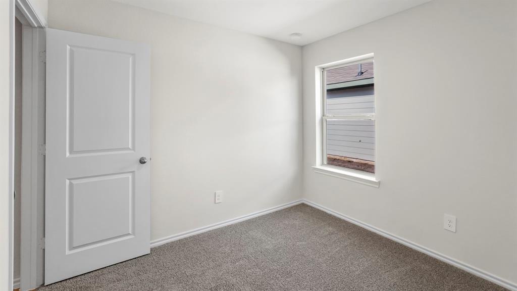 512 Yellow Rose Road Princeton, TX 75407 - Photo 16 of 37 a view of an empty room and window