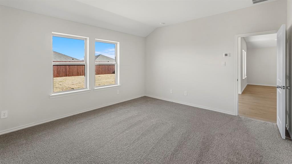 512 Yellow Rose Road Princeton, TX 75407 - Photo 20 of 37 a view of an empty room with a window