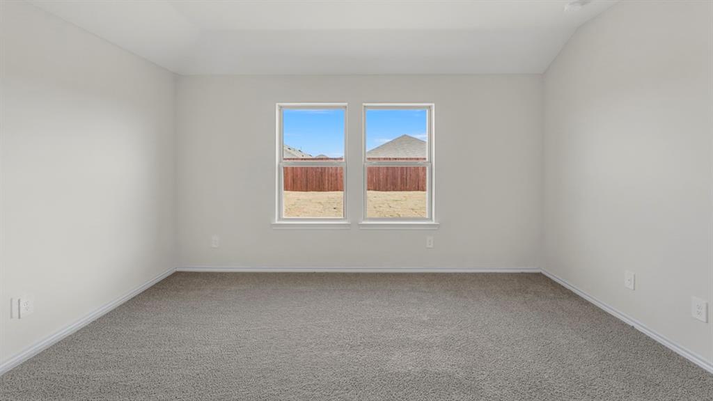512 Yellow Rose Road Princeton, TX 75407 - Photo 4 of 37 an empty room with a window