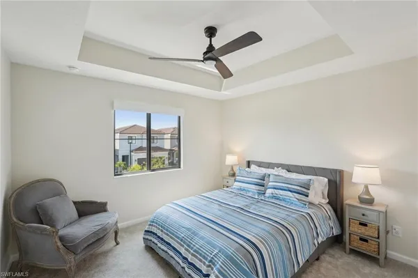 a bedroom with bed and window