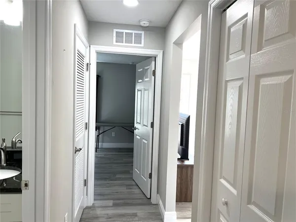 a view of a bathroom from a hallway