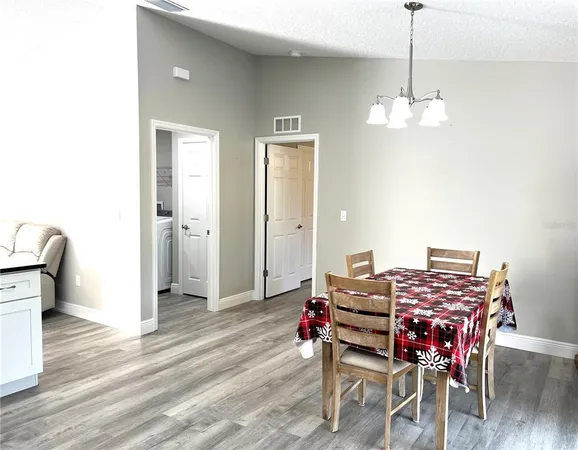 a room with furniture and wooden floor