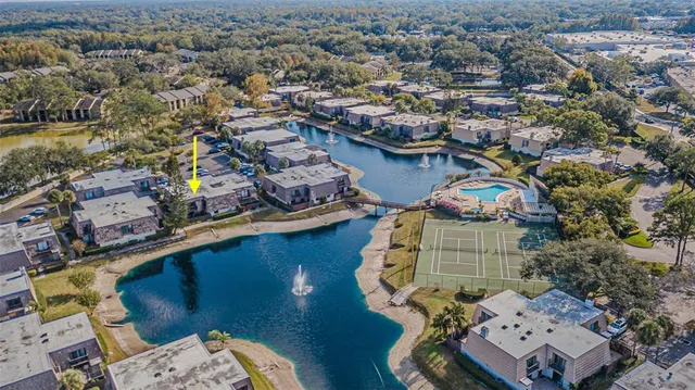 an aerial view of a house with outdoor space